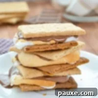Air Fryer S'mores Magic 10 A stack of S'mores on a plate.