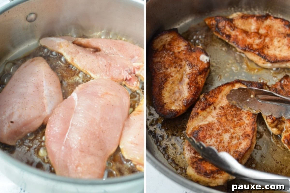 Velvety Roasted Red Pepper Chicken 5 Golden-brown chicken breasts sizzling in melted butter in a hot, heavy-bottomed skillet, creating a delicious crust.