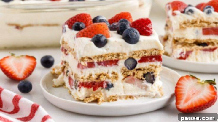 A refreshing mixed berry icebox cake with layers of graham crackers, fluffy filling, and fresh berries.