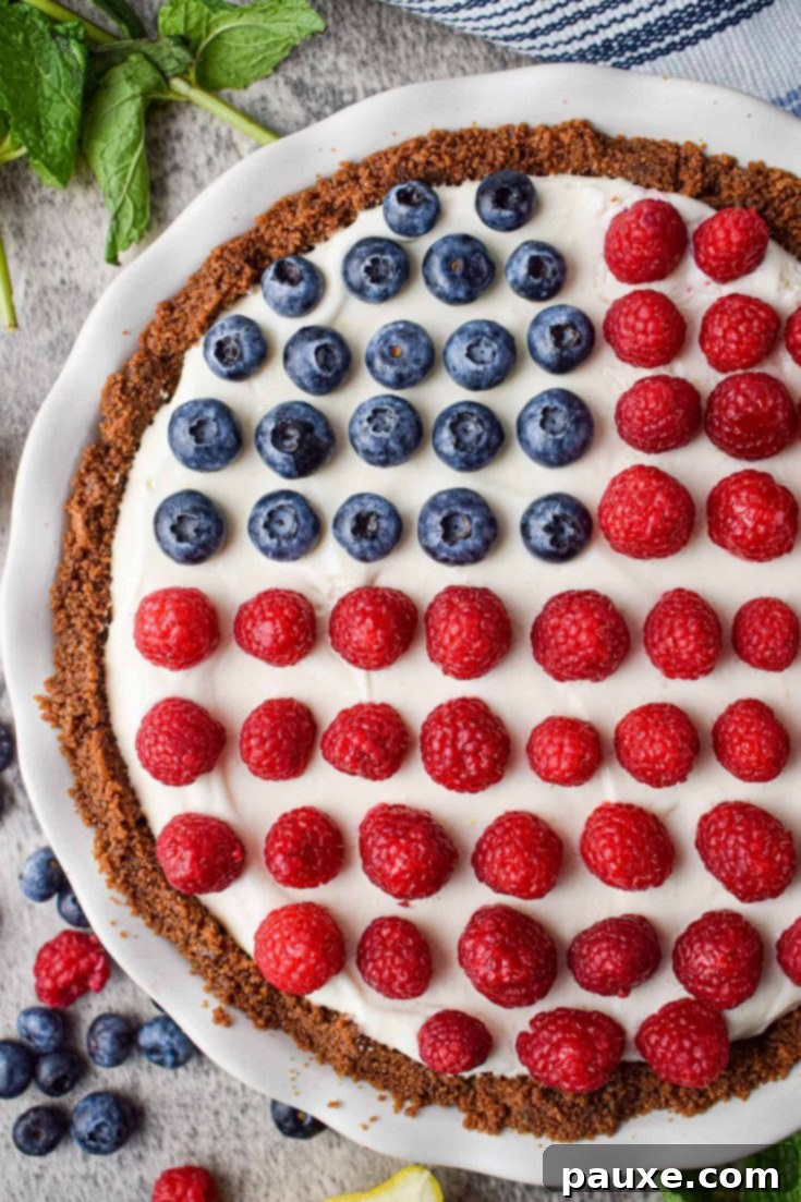An adorable and easy no-bake 4th of July pie, beautifully decorated with patriotic colors and fresh fruit.