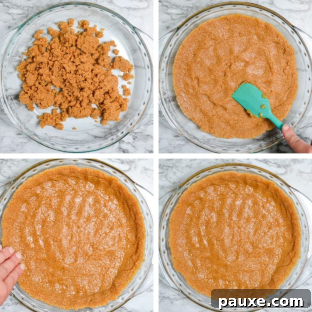 A perfectly formed no-bake graham cracker pie crust chilling in a glass pie dish.