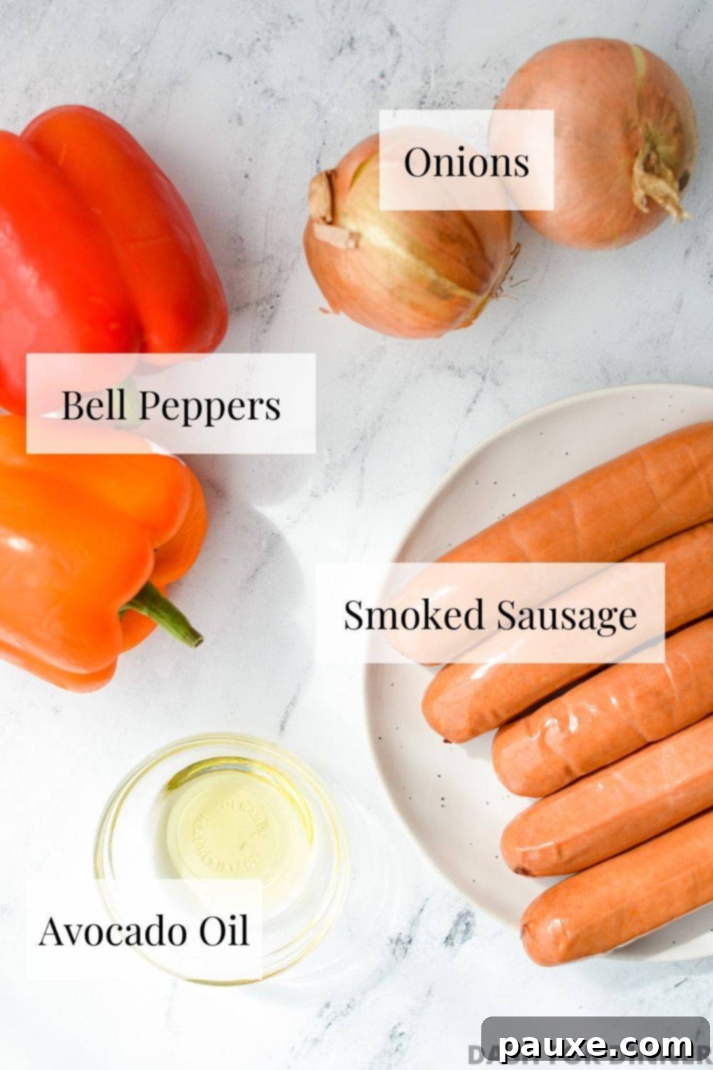 Crispy Air Fryer Sausage and Peppers 3 A flat lay of peppers, onions, smoked sausage, and oil.