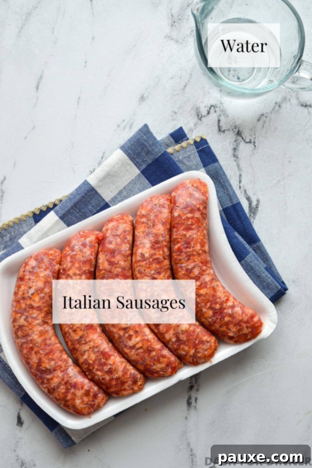 Crispy Air Fryer Italian Sausages 3 A package of fresh Italian sausages and a small glass of water, ready for air frying.