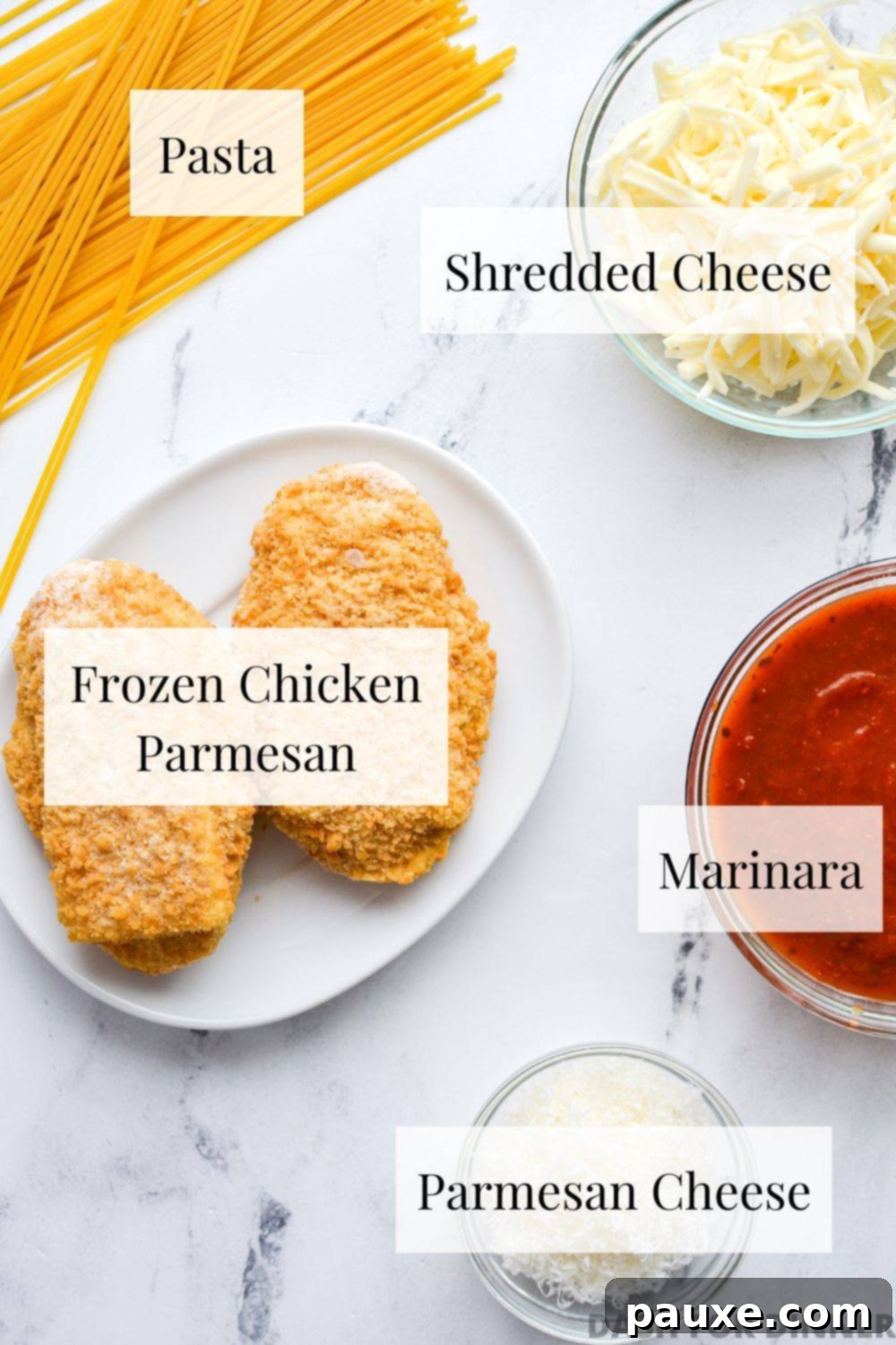 The essential ingredients for air fryer frozen chicken parmesan: a package of frozen chicken parmesan, dry spaghetti, a jar of marinara sauce, shredded mozzarella, and grated Parmesan cheese.