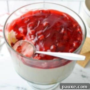 Effortless Cheesecake Delight 13 A trifle dish filled with no bake cheesecake and a cherry pie filling.