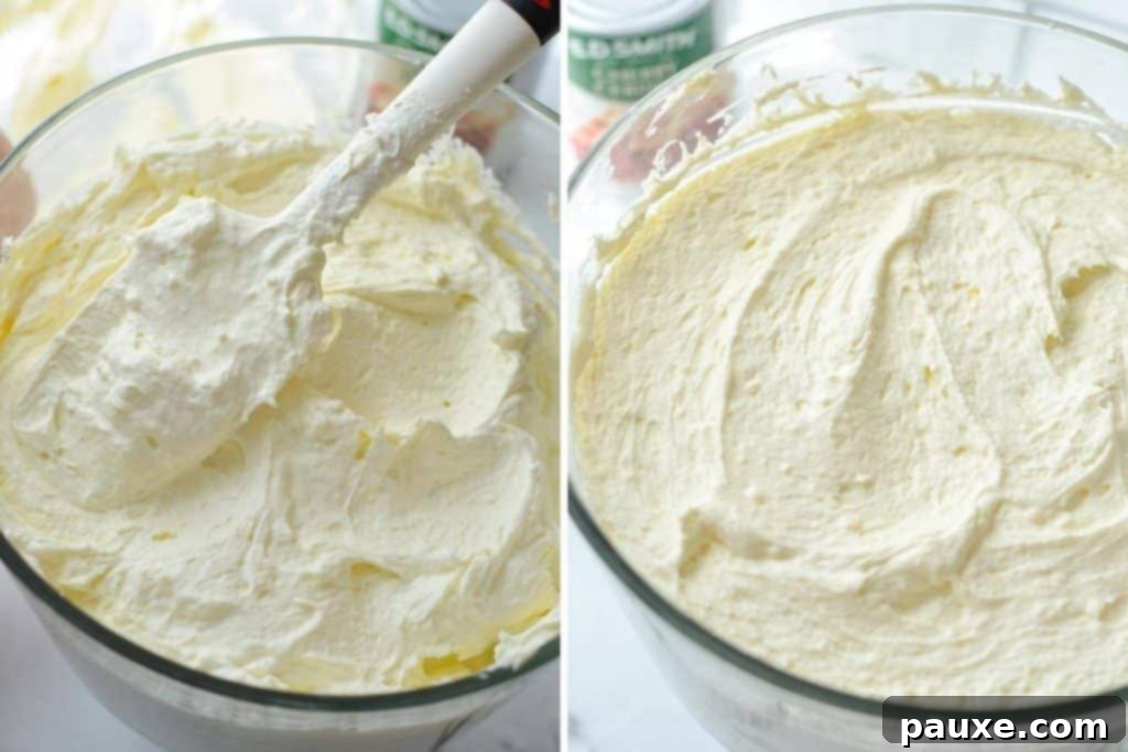 Effortless Cheesecake Delight 6 A smooth layer of no-bake cheesecake base being spread evenly into a large trifle dish, ready for the next layer of fruit filling.