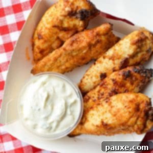 Air Fryer Naked Chicken Tenders 9 A small takeout box with plain chicken tenders and ranch dip.