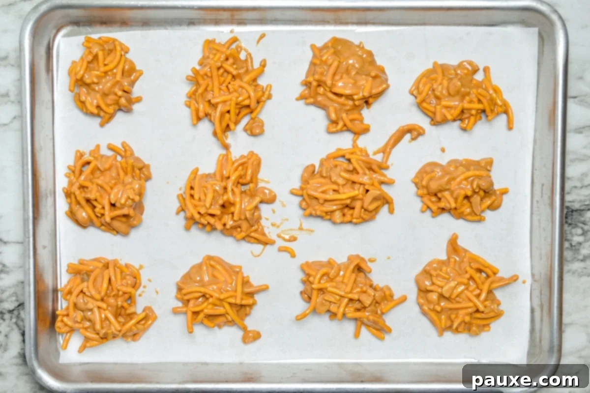 Quick No-Bake Butterscotch Haystacks 5 A sheet pan filled with freshly formed butterscotch haystack cookies, ready for chilling.