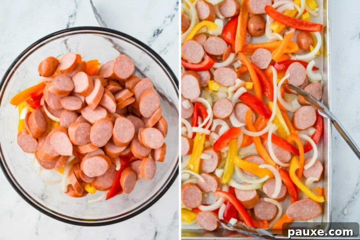 One-Pan Smoked Sausage and Peppers Feast 5 A large bowl containing perfectly sliced smoked sausages, vibrant bell pepper strips, and sweet onions, all mixed with oil.