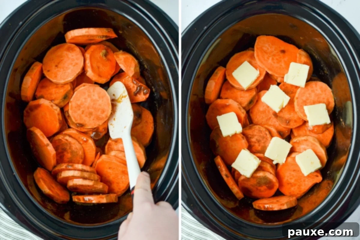 Slow Cooker Candied Sweet Potatoes 5 Cubed butter being placed strategically on top of sliced sweet potatoes within a slow cooker, before the lid is added for cooking the glazed sweet potatoes.