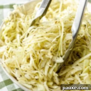 Swedish Pizza Slaw 10 Tongs taking a portion of a refreshing Swedish Pizza Salad from a bowl.