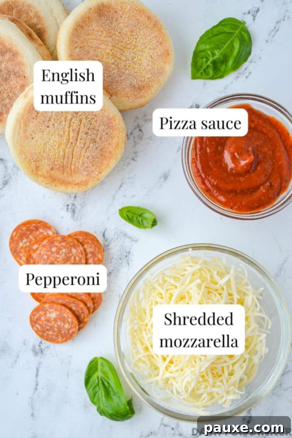The ingredients needed to make English muffin pizzas, including sauce, pepperoni, and cheese.