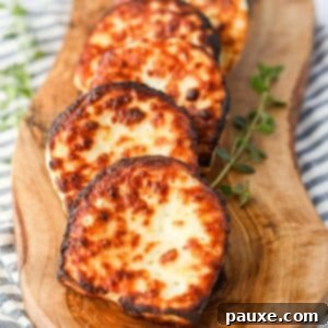 Golden Air Fryer Halloumi 10 A wooden board showcasing beautifully air-fried Halloumi cheese slices, ready to be served.
