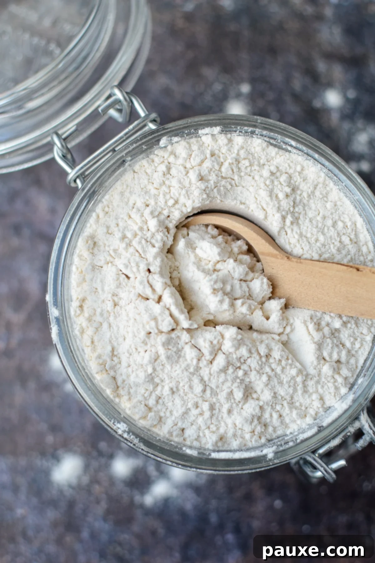 Homemade Self-Rising Flour in Minutes 2 A small jar of homemade self rising flour, ready to use in baking.