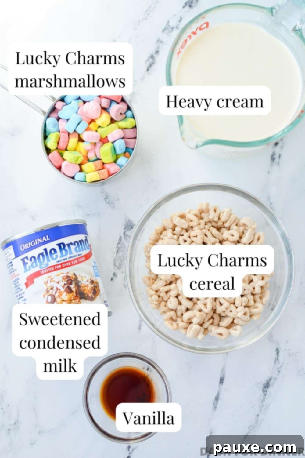 Enchanted Cereal Swirl 3 The four main ingredients laid out: a box of Lucky Charms cereal, a carton of heavy cream, a can of sweetened condensed milk, and a bottle of vanilla extract.