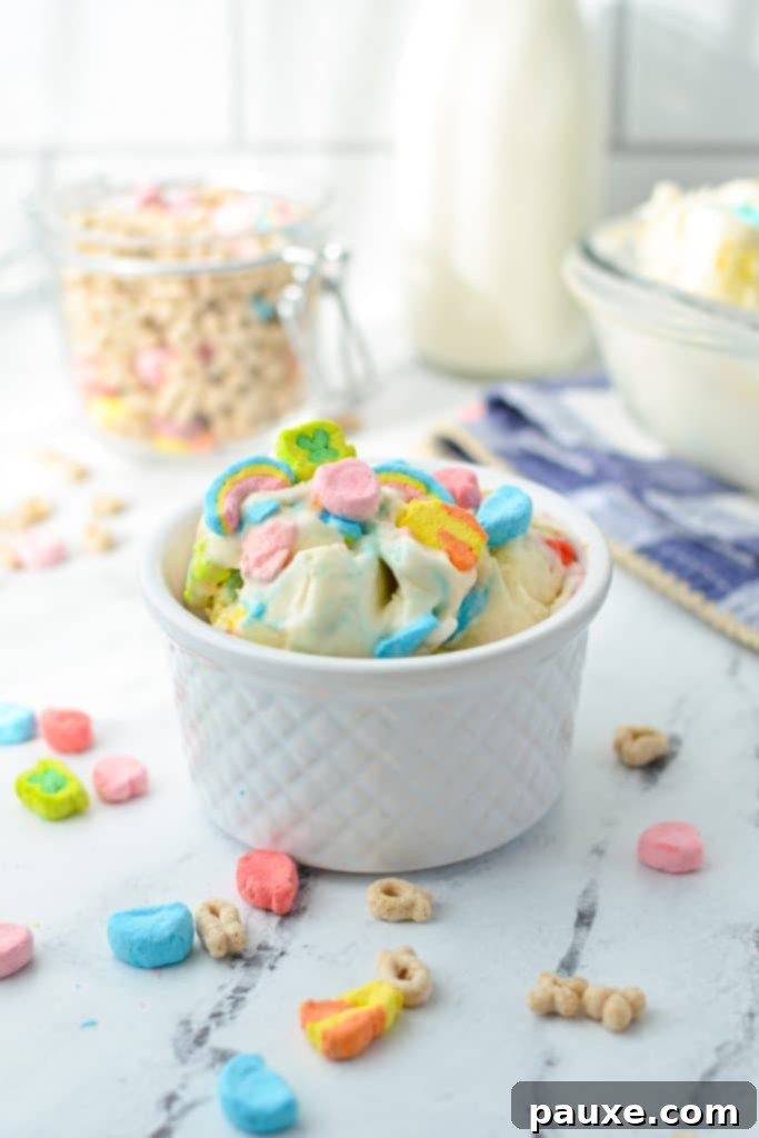 Enchanted Cereal Swirl 9 A small bowl featuring creamy Lucky Charms ice cream, highlighting its texture and colorful marshmallows.