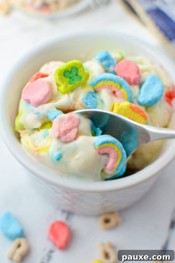 Enchanted Cereal Swirl 10 A spoon taking a perfect spoonful of creamy homemade Lucky Charms ice cream, ready to be enjoyed.