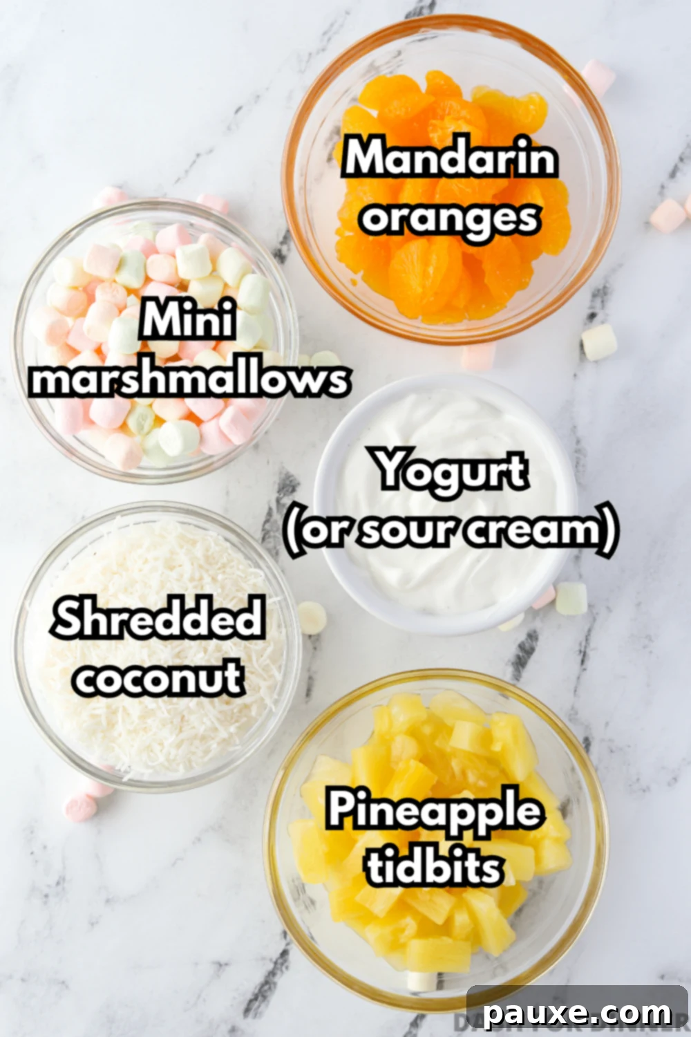 Five Cup Delight 3 An overhead view of five individual bowls containing mandarin oranges, mini marshmallows, vanilla yogurt, shredded coconut, and pineapple tidbits.