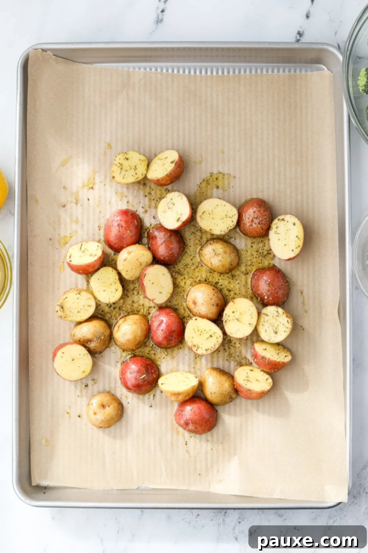 Golden Roasted Broccoli and Potatoes 5 Spreading halved and oiled baby potatoes onto a baking sheet.