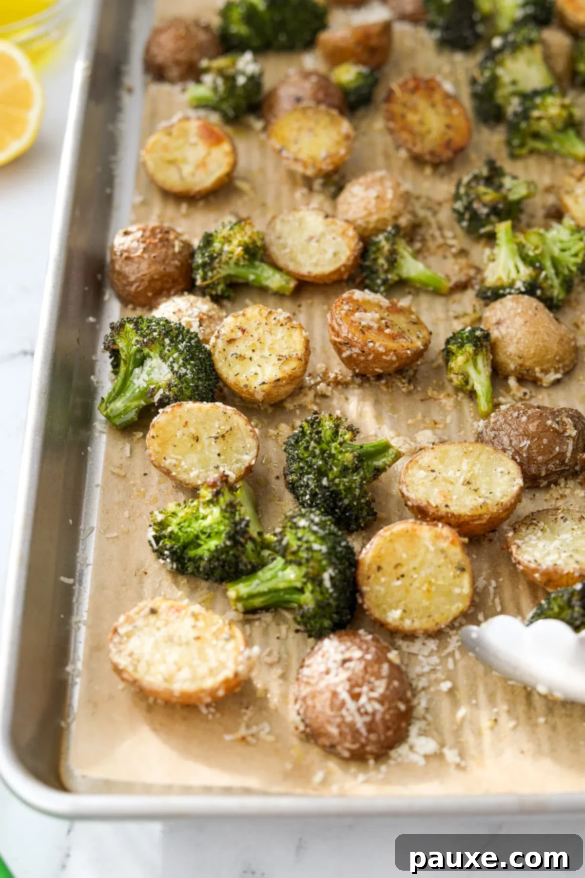 Golden Roasted Broccoli and Potatoes 8 Potatoes and broccoli on a sheet pan.