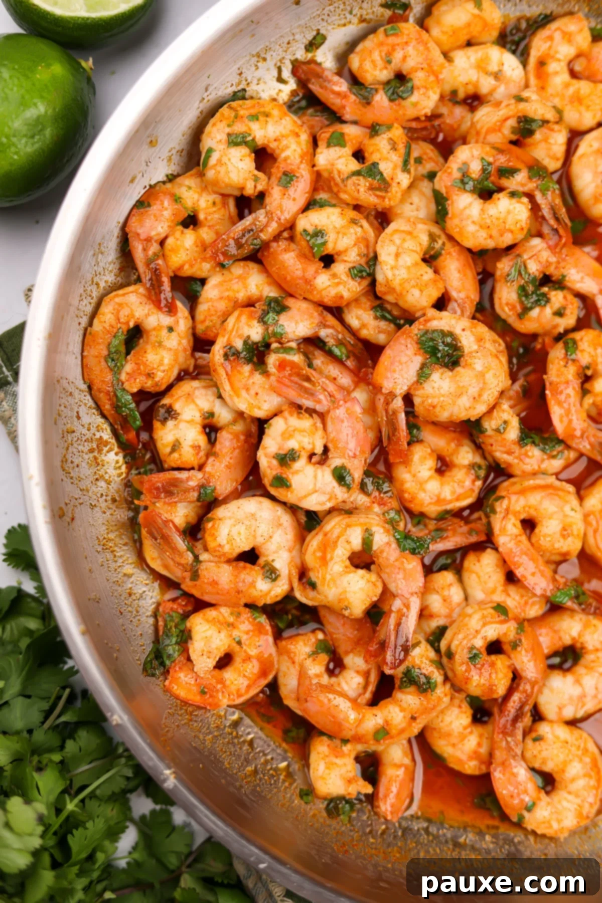 Zesty Cilantro Lime Shrimp 5 A close-up of perfectly cooked shrimp coated in a vibrant red sauce, ready to be served from the skillet.