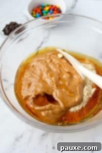 Protein-Packed Cookie Dough Bites 14 Stirring together a protein cookie dough.