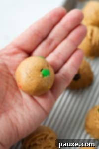 Protein-Packed Cookie Dough Bites 18 Rolling cookie dough into a smooth ball.