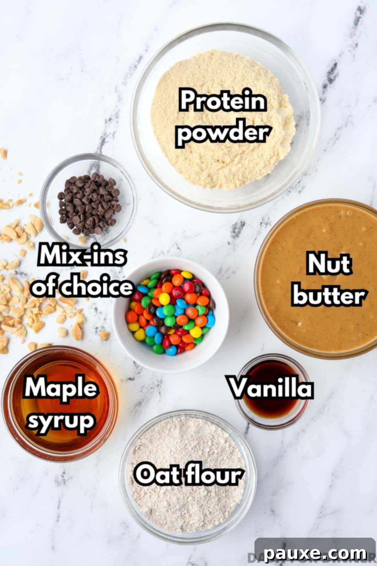 Protein-Packed Cookie Dough Bites 3 The ingredients needed to make protein balls: natural nut butter, vanilla protein powder, pure maple syrup, oat flour, vanilla extract, and various mix-ins like chocolate chips.