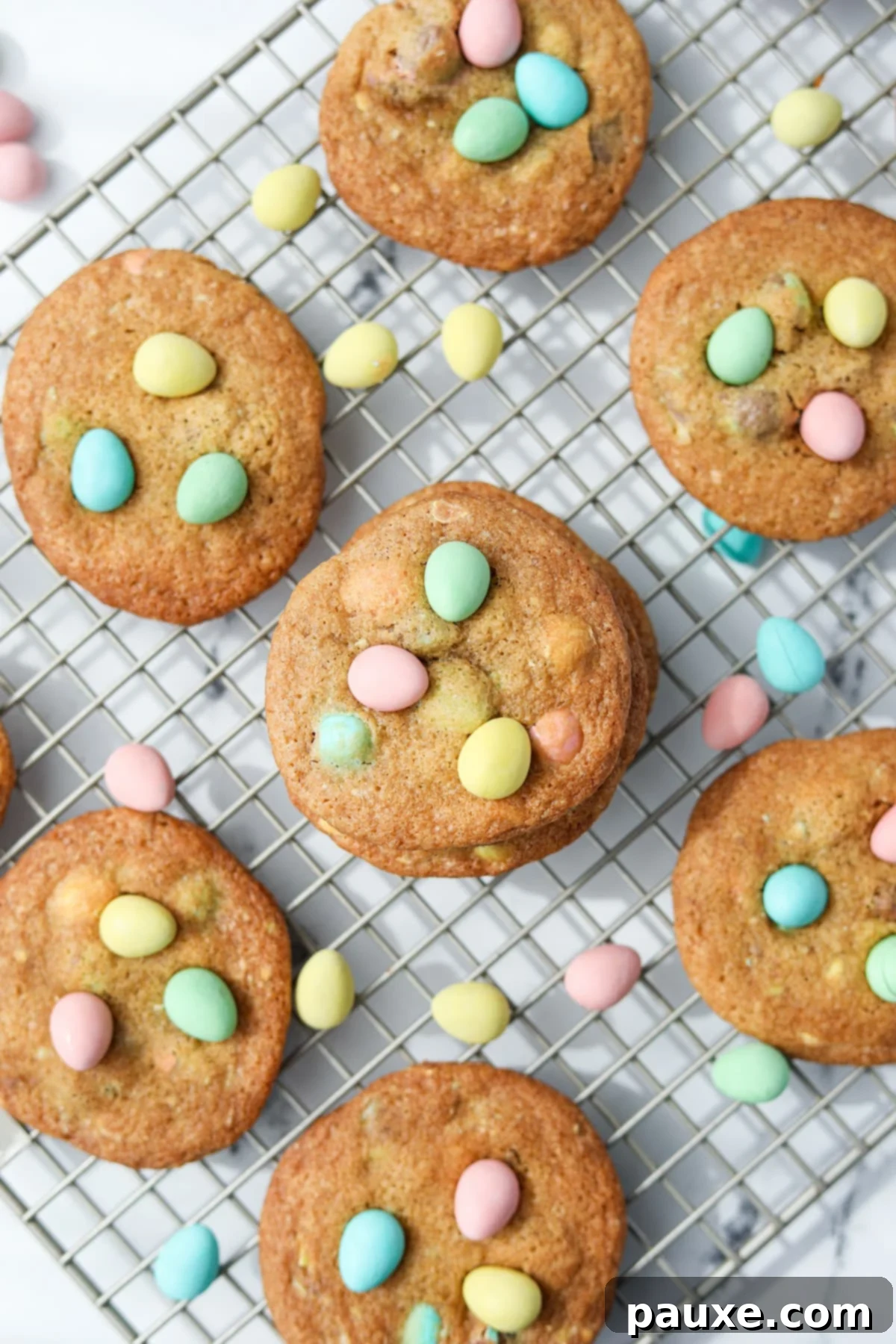 Speckled Spring Cookies 2 Homemade cookies on a cooling rack, dotted with mini eggs, ready to be enjoyed.