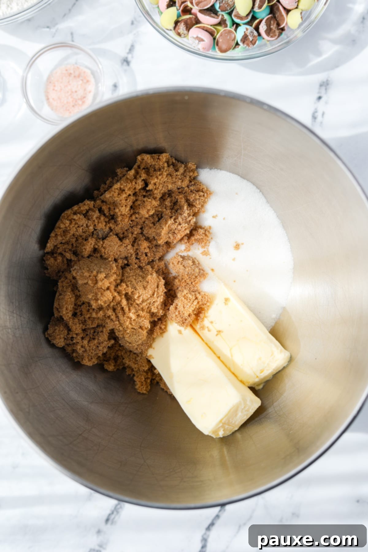 Speckled Spring Cookies 5 A stand mixer bowl with butter, brown sugar, and white sugar being combined.