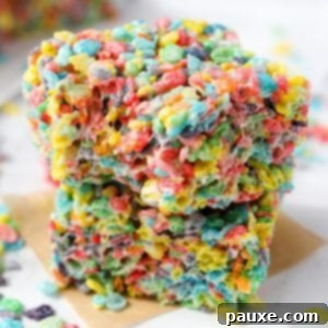 Colorful Pebbles Bars 11 Two cereal treats stacked , made with Fruity Pebbles.