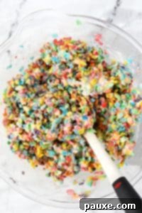 Colorful Pebbles Bars 14 A bowl of fruity pebbles mixed with melted marshmallows.