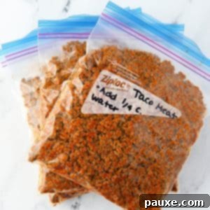 Three freezer bags filled with taco meat.