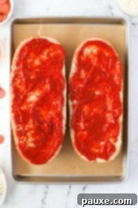 Speedy French Bread Pizzas 15 Spreading pizza sauce on French bread halves.