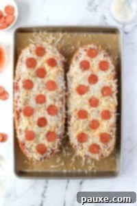 Speedy French Bread Pizzas 17 Two halves of French Bread pizza topped with pepperoni.