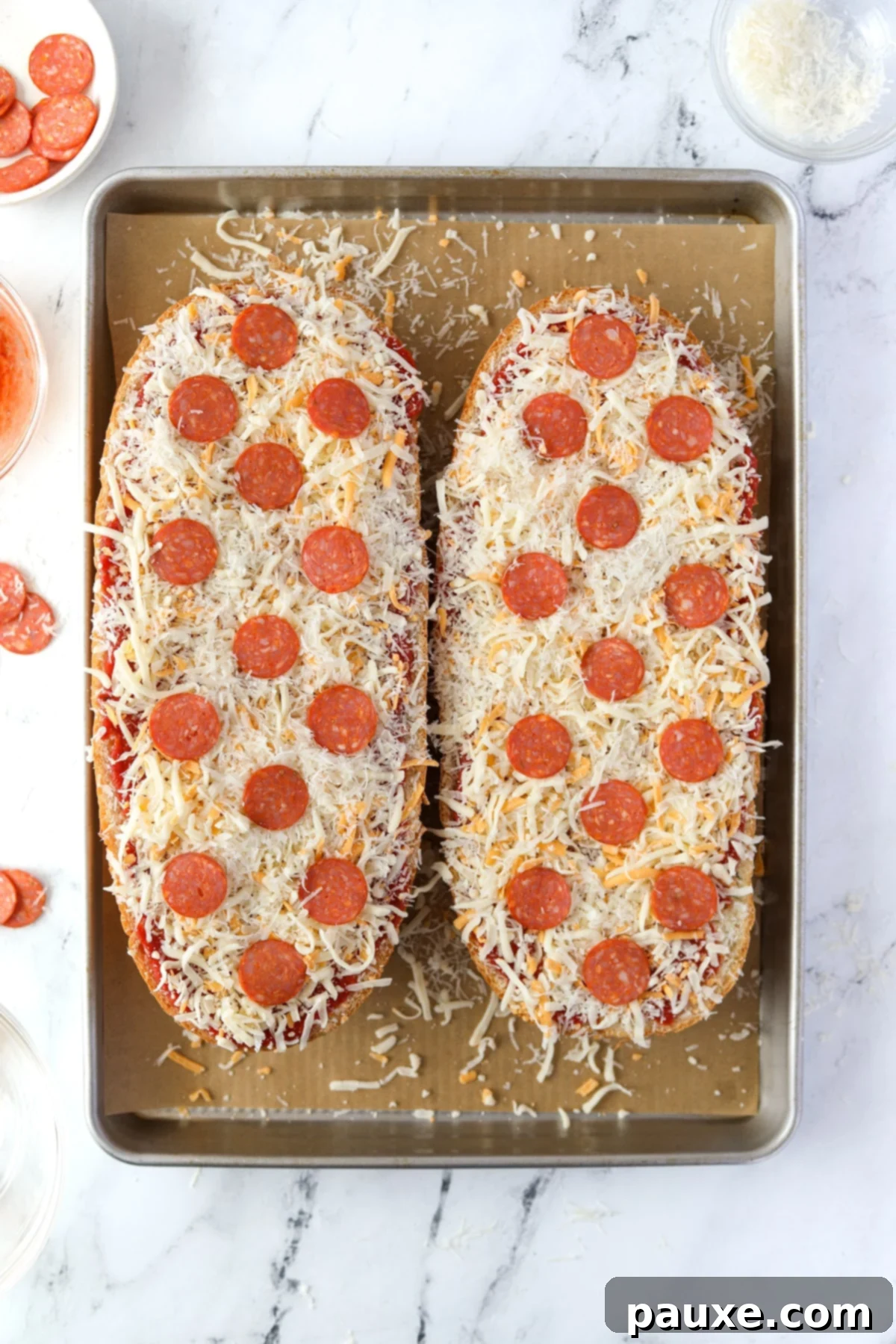 Speedy French Bread Pizzas 7 Two halves of French Bread pizza topped with pepperoni.