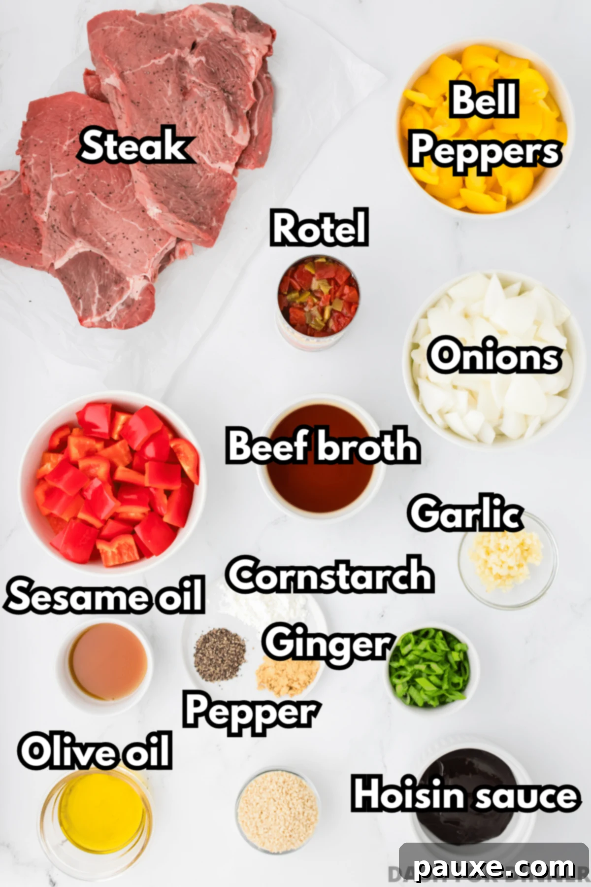 Easy Slow Cooker Pepper Steak 3 The ingredients needed to make pepper steak: beef, hoisin, sesame oil, beef broth, bell peppers, etc., laid out on a wooden surface.