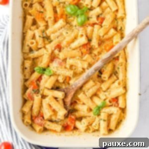 Creamy Boursin Pasta Bake 15 A baking dish with creamy Boursin pasta garnished with fresh basil, ready to be served as an easy weeknight meal.