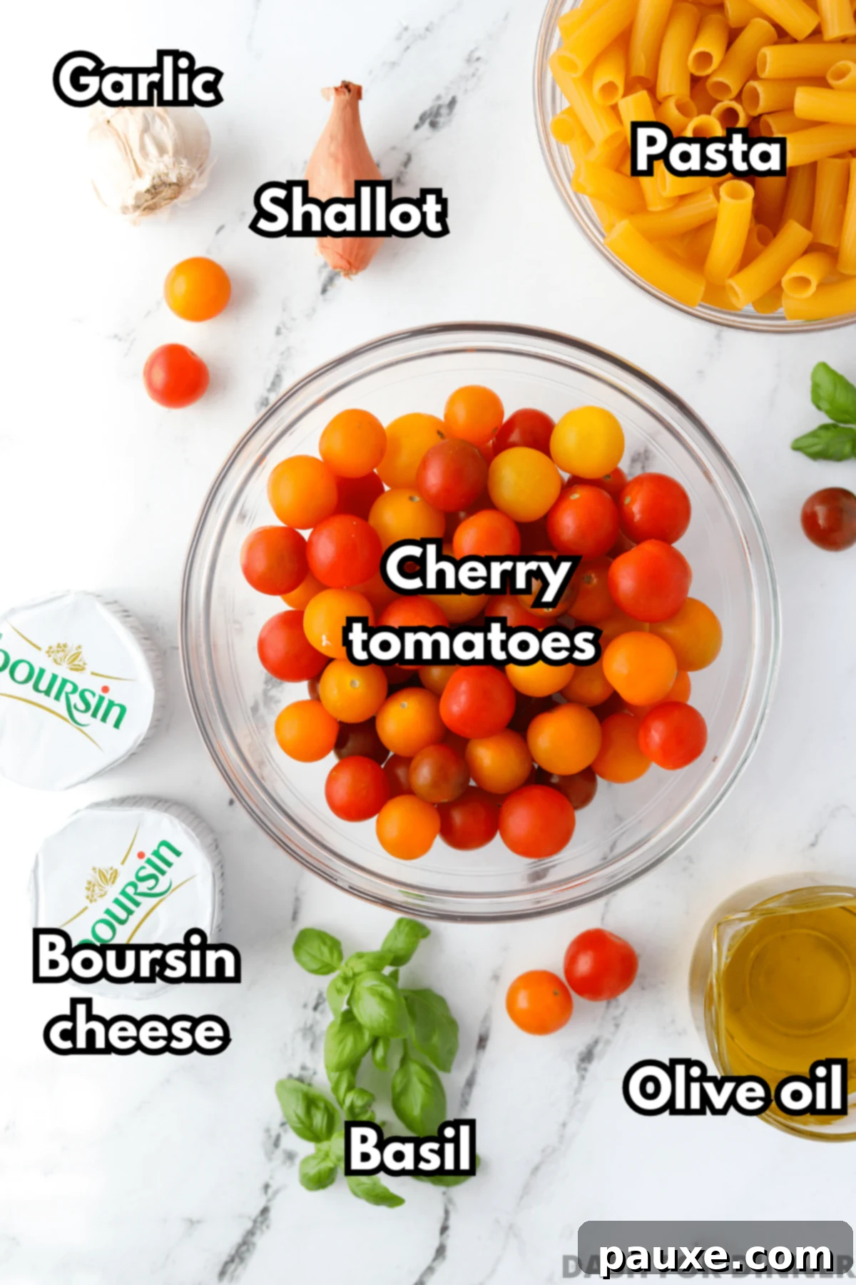 Creamy Boursin Pasta Bake 3 The essential ingredients laid out for making Boursin pasta: fresh cherry tomatoes, a round of Boursin cheese, olive oil, pasta, basil, garlic, and a shallot.