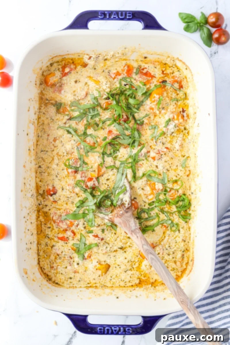 Creamy Boursin Pasta Bake 8 A baking dish with the roasted tomato and Boursin mixture, now mashed into a creamy sauce with fresh basil added.