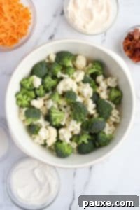 Creamy Amish Broccoli Salad 14 A large bowl with broccoli and cauliflower florets.