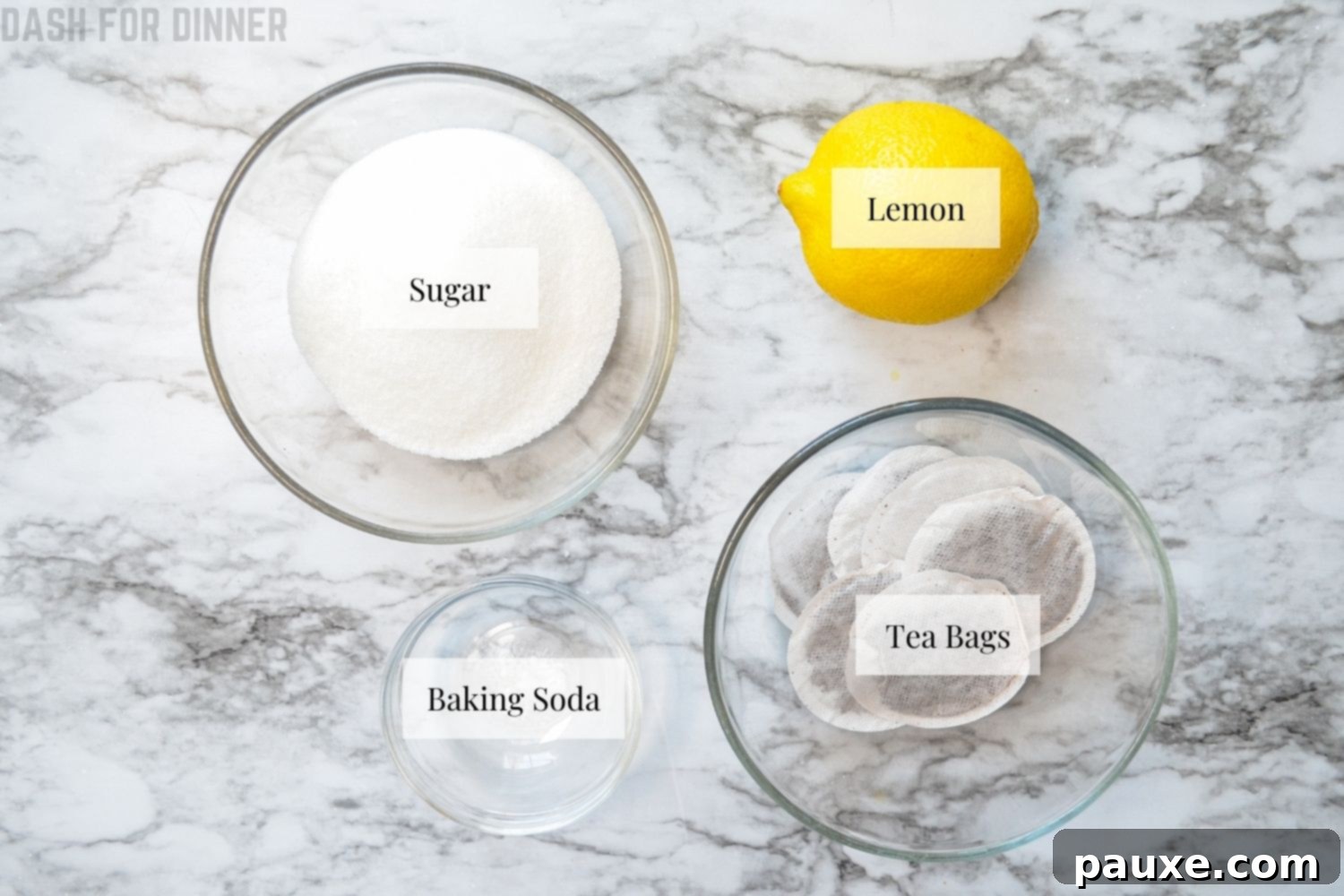 Crystal Clear Instant Pot Iced Tea 3 Ingredients laid out for making Instant Pot Iced Tea including tea bags, sugar, baking soda, and lemons.