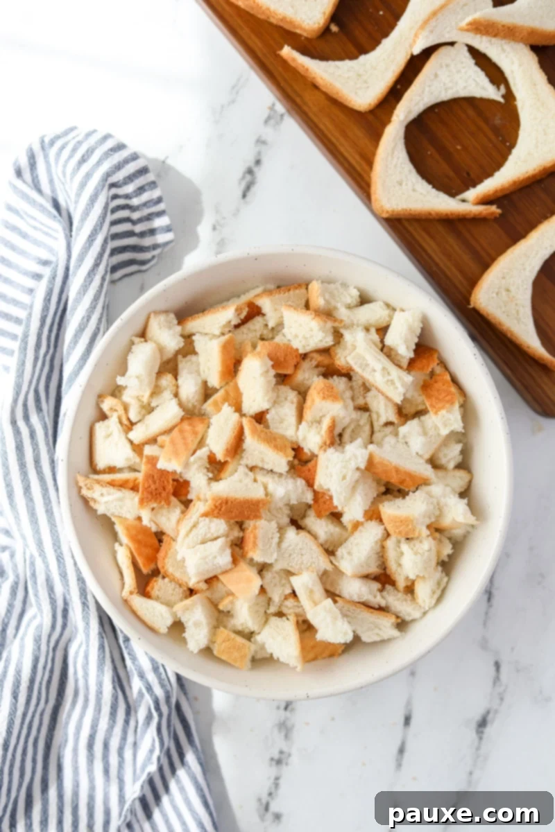 DIY Crustless Sandwich Pockets 13 A bowl filled with leftover bread crusts and trimmings from making crustless sandwiches, ready for repurposing.