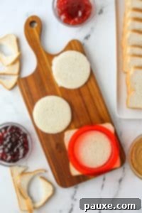 DIY Crustless Sandwich Pockets 14 Using a round sandwich cutter to cut bread into rounds.