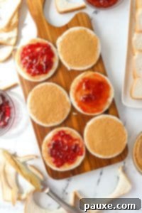 DIY Crustless Sandwich Pockets 16 Spreading jam and jelly on top of peanut butter coated bread slices.