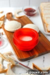 DIY Crustless Sandwich Pockets 17 Using a sandwich sealer to press two sides of a sandwich together.