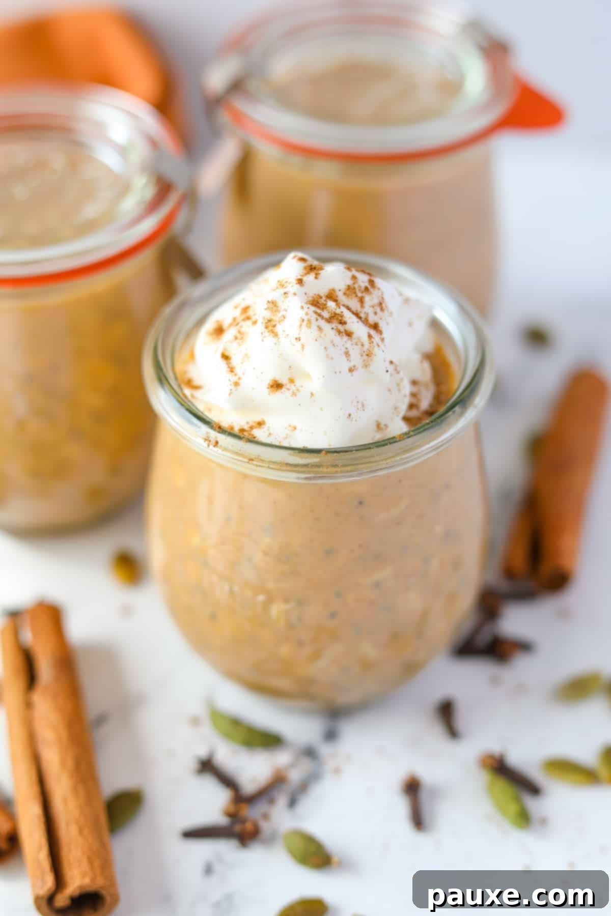 Pumpkin Spice Overnight Oats 11 A small jar of pumpkin overnight oatmeal, garnished with whipped cream.