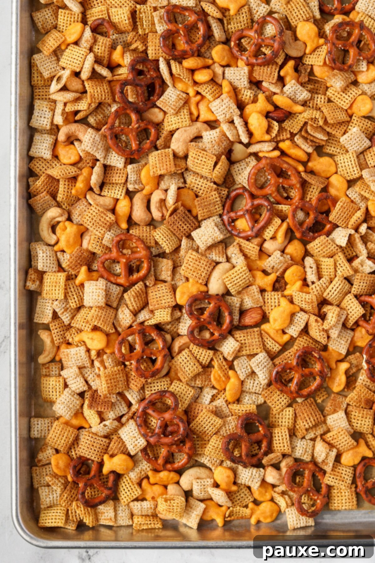 Savory Goldfish Crunch Mix 13 A baking sheet filled with Chex Mix.