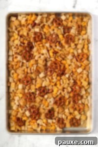 Savory Goldfish Crunch Mix 20 A baking pan with homemade snack mix on it.