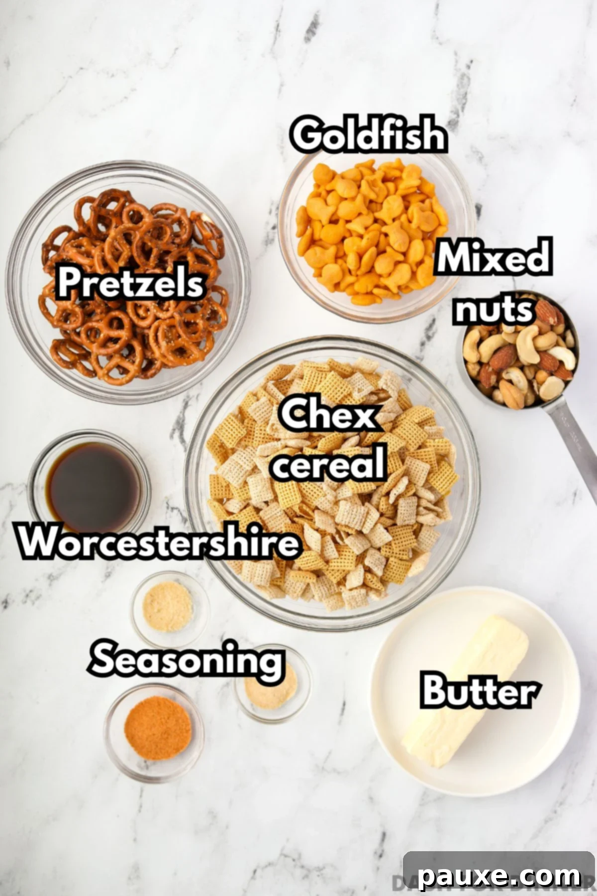 Savory Goldfish Crunch Mix 3 The ingredients needed to make snack mix: cereal, butter, pretzels, crackers, and nuts.